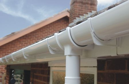 PVC gutter and downpipe fitted to a house